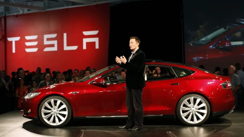 Elon Musk in front of the Tesla model S
