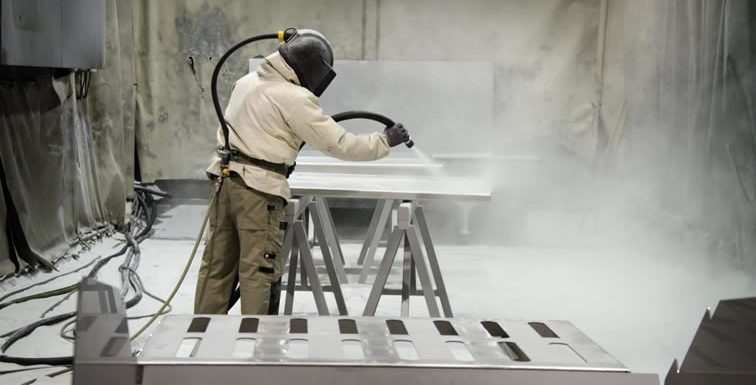 How does a sandblasting machine work