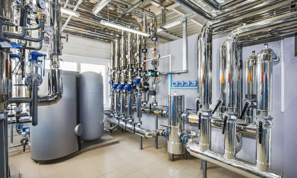 A modern manufacturing facility with a selection of stainless steel boilers. Each contains an industrial filter.