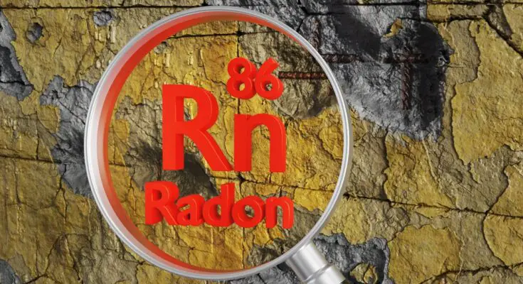 A magnifying glass is held up to a cracked yellow and gray wall. The element symbol for Radon is shown in red letters.